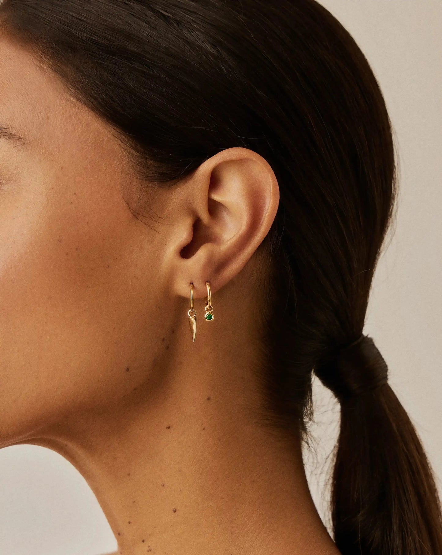 Tennis Charm Mini Hoop Earrings | 18k Gold Vermeil/Emerald Green Nano-crystal Earrings Missoma