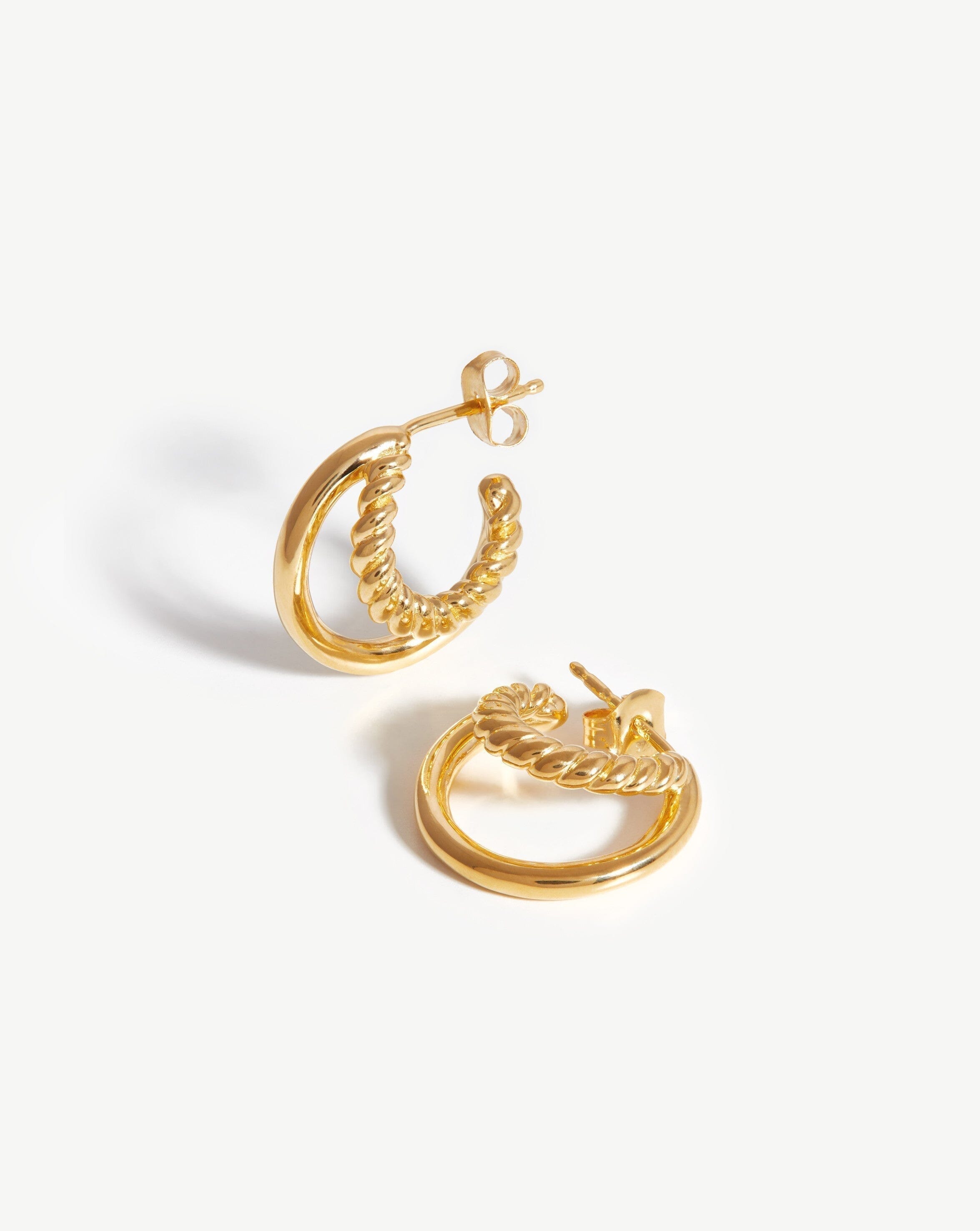 http://us.missoma.com/cdn/shop/products/mini-radial-hoop-earrings-18ct-gold-plated-earrings-missoma-178919.jpg?v=1677007963