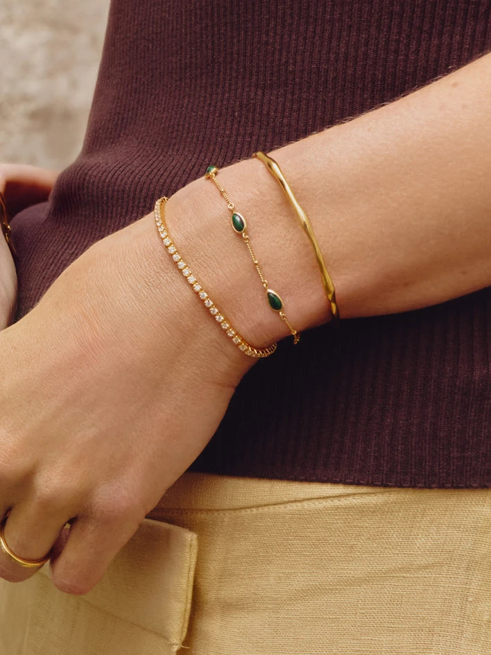 tennis bracelet and gold bangle bracelets
