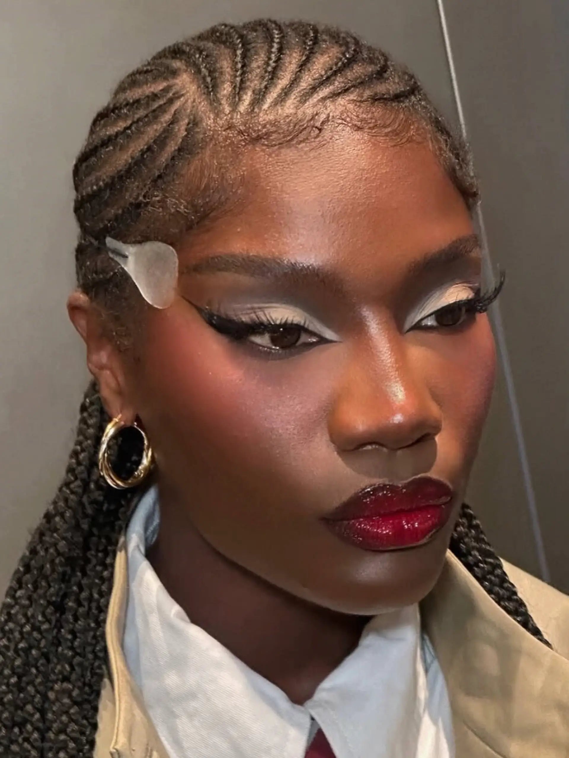 doechii silver and gold hoop earrings