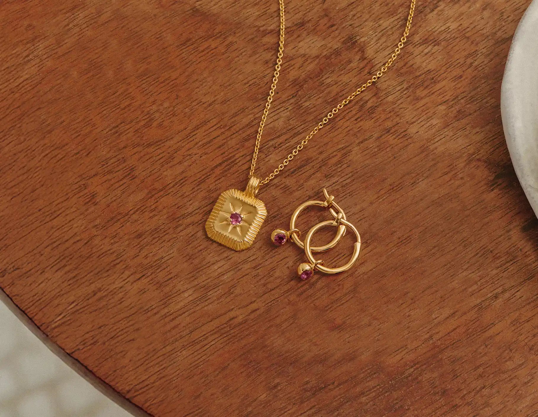 gold birthstone necklace and charm hoop earrings set