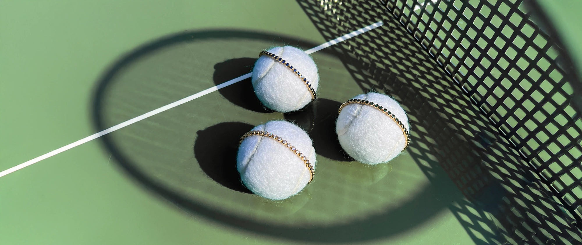 Tennis Bracelets on top of Tennis Balls