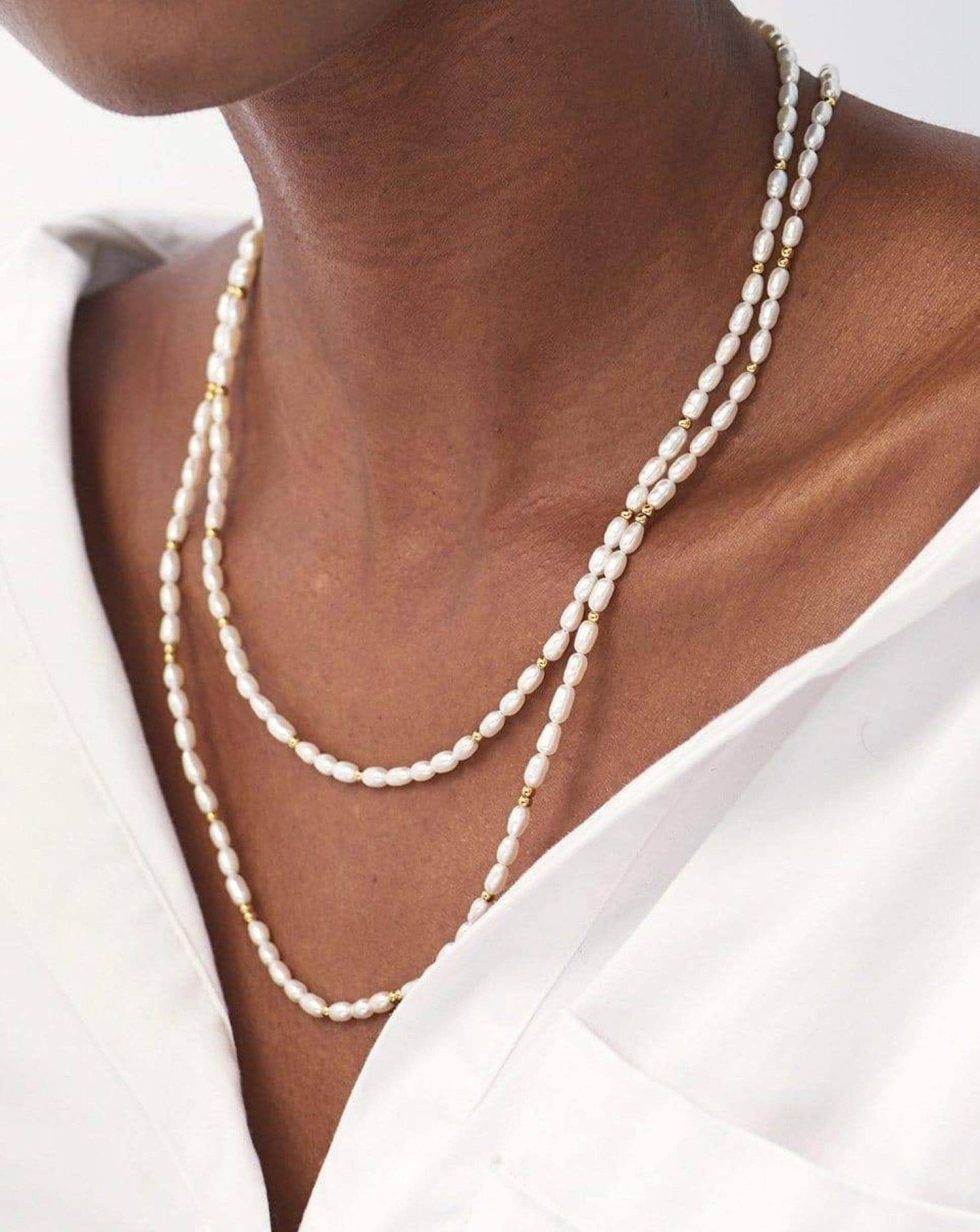 Six strand natural white freshwater and seed pearl necklace