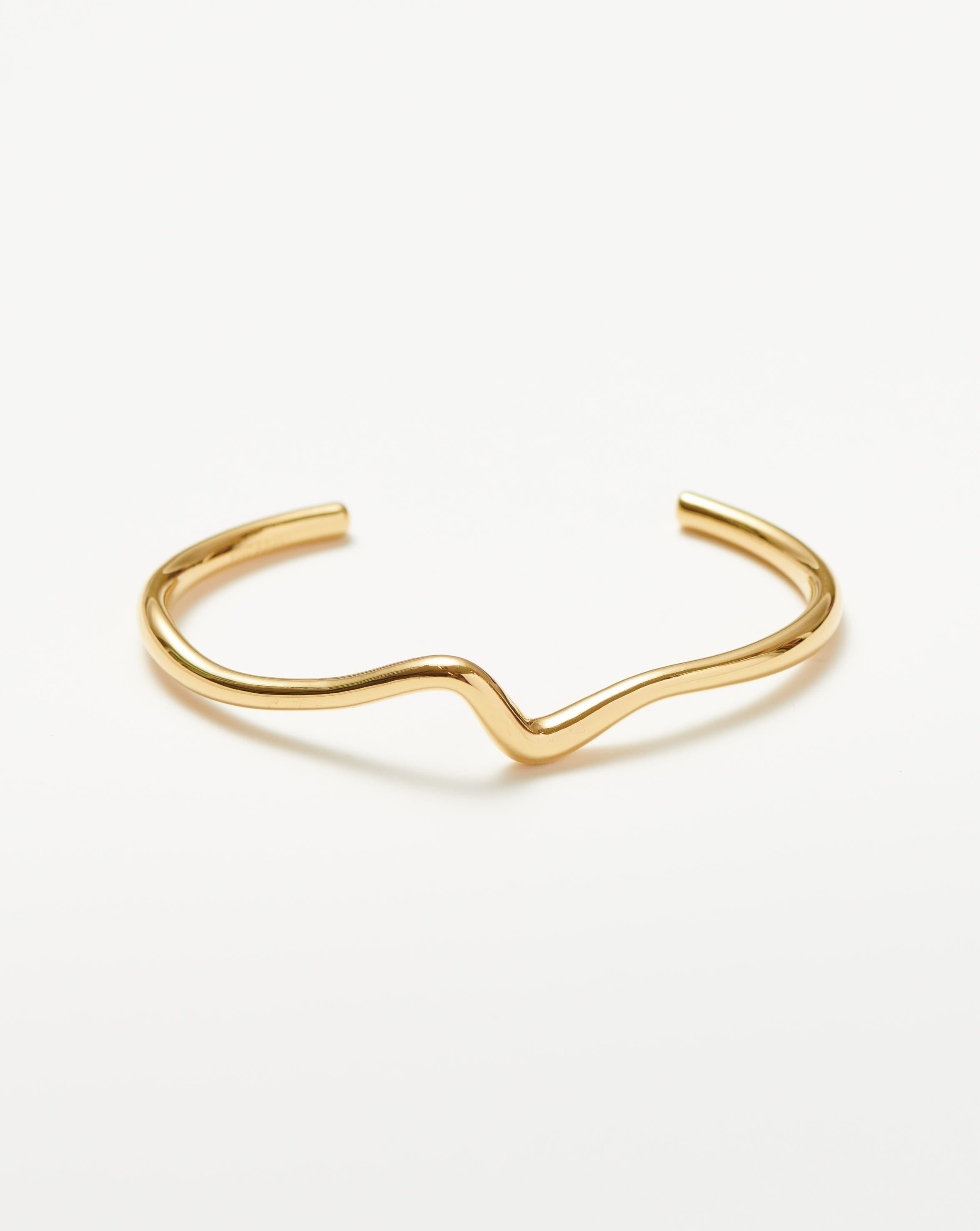 Missoma Molten Wave gold cuff bracelet on white
